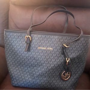 Michael Kors tote.Has few white specks on front of bag.